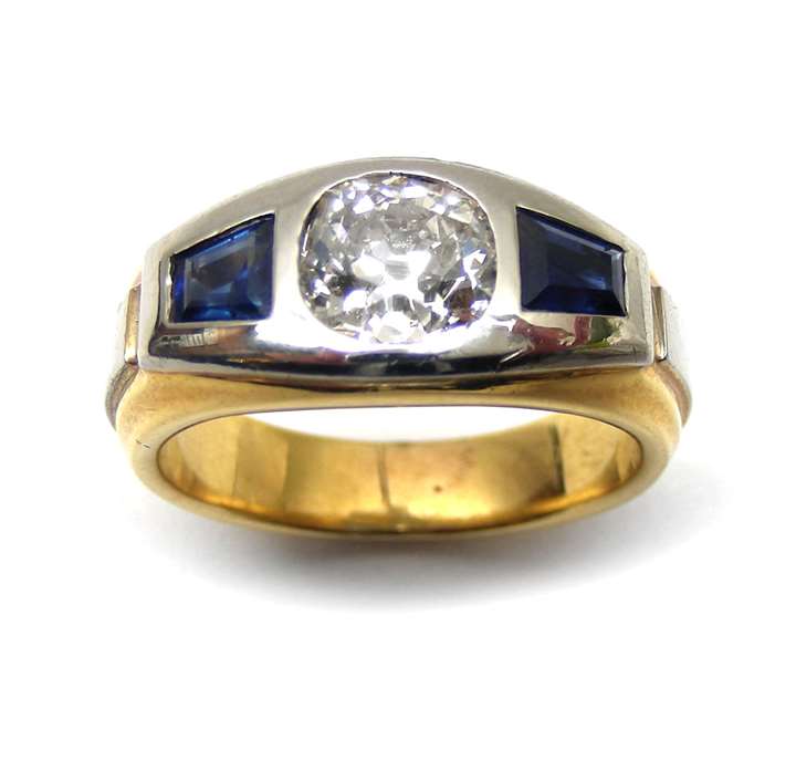 Brilliant cut diamond and sapphire three stone ring